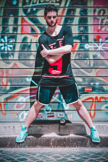 Man Wearing Black Black T-shirt and Black Gym Shorts Man Wearing Black Black T-shirt and Black Gym Shorts