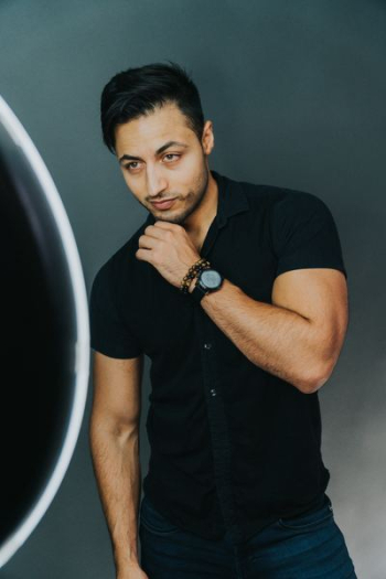 man wearing black button-up collared shirt man wearing black button-up collared shirt
