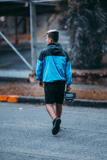 Man Wearing Blue Hooded Jacket Walking Man Wearing Blue Hooded Jacket Walking
