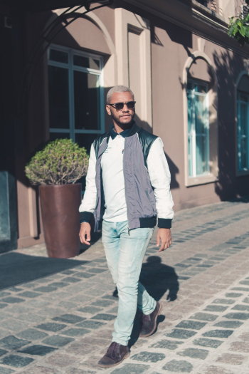 Man Wearing Blue Jeans Walking Beside Brown Vase Man Wearing Blue Jeans Walking Beside Brown Vase