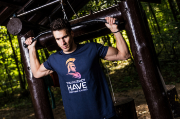 Man Wearing Blue Shirt Using Gym Equipments Man Wearing Blue Shirt Using Gym Equipments