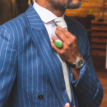 Man Wearing Blue Tuxedo Holding Tie Man Wearing Blue Tuxedo Holding Tie