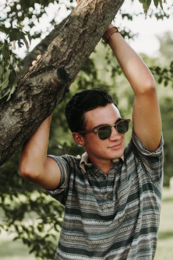 man wearing brown polo shirt