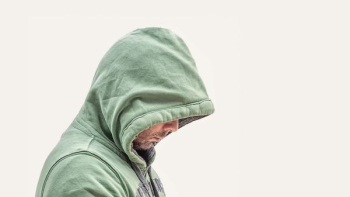 man wearing green hooded jacket with white background man wearing green hooded jacket with white background