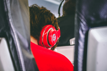 Man Wearing Red Beats By. Dre Headphones Man Wearing Red Beats By. Dre Headphones