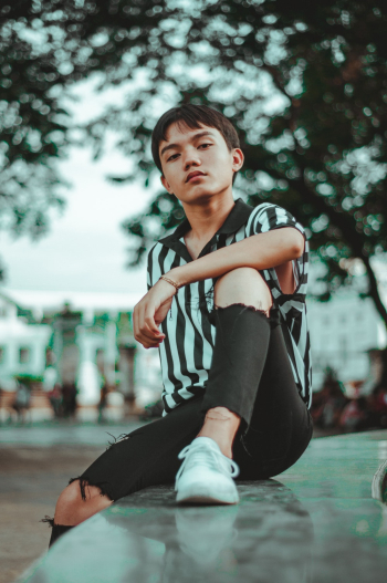 Man Wearing Striped Shirt and Ripped Jeans Man Wearing Striped Shirt and Ripped Jeans