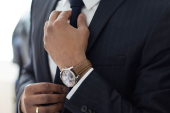 man wearing watch with black suit man wearing watch with black suit