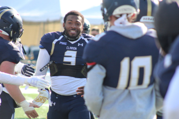 Man Wearing White And Blue Under Armour Football Jersey Man Wearing White And Blue Under Armour Football Jersey
