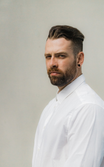 Man Wearing White Dress Shirt With Piercing Look With His Eyes Man Wearing White Dress Shirt With Piercing Look With His Eyes
