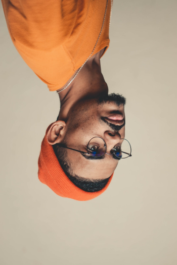Man Wears Orange Knit Cap and Shirt Man Wears Orange Knit Cap and Shirt