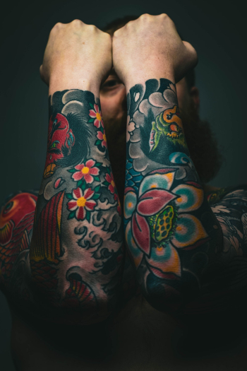Man With Floral Arm Tattoos` Man With Floral Arm Tattoos`