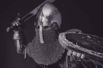 man with steel and chainmail armor holding sword man with steel and chainmail armor holding sword