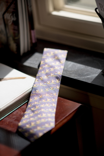 Maroon and Brown Necktie on Table Maroon and Brown Necktie on Table