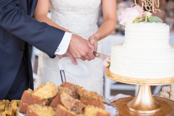 Married Couple Cutting Cake Together