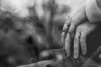 Married couple holding hands