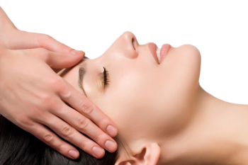 masseuse does relax facial massage to the girl