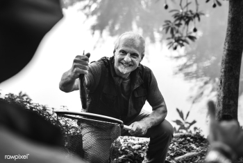 Mature man with a freshly caught fish | Free stock photo - 416853 Mature man with a freshly caught fish | Free stock photo - 416853