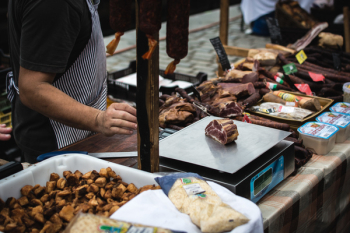 Meat vendor at farmers market 