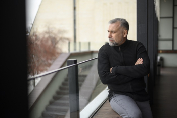 Medium shot man sitting on a sill Free Photo Medium shot man sitting on a sill Free Photo