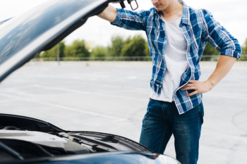 Medium shot of man checking engine Free Photo Medium shot of man checking engine Free Photo