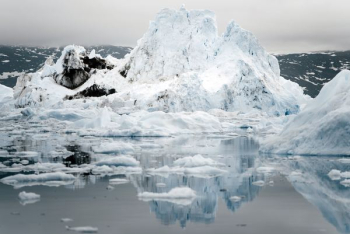 melted iceberg on body of water melted iceberg on body of water