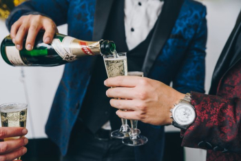 Men In Tuxedos Pouring Sparkling Wine Men In Tuxedos Pouring Sparkling Wine