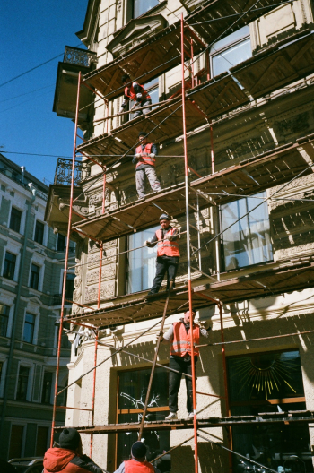 Men on Brown Scaffolding Men on Brown Scaffolding