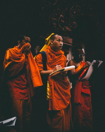 men wearing orange tops