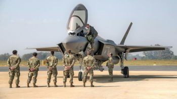 Military Personnel Observing F-35 Stealth Fighter Aircraft Military Personnel Observing F-35 Stealth Fighter Aircraft