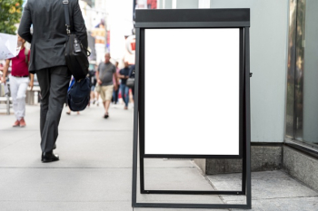 Mobile mock-up billboard on sidewalk Free Photo