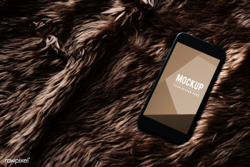 Mobile phone screen mockup on fur surface | Free stock psd mockup - 527467