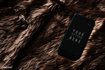 Mobile phone screen mockup on fur surface | Free stock psd mockup - 527493