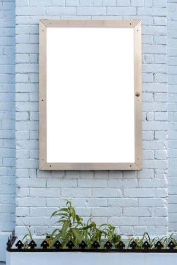 Mock-up billboard on a brick wall Free Photo