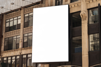 Mock-up billboard on a city building Free Photo