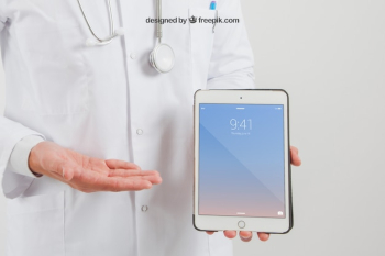 Mock up of tablet on doctor's hands