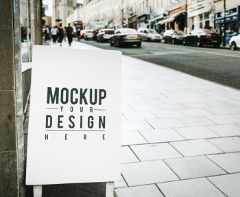 Mockup poster on the outside of a shop Free Psd