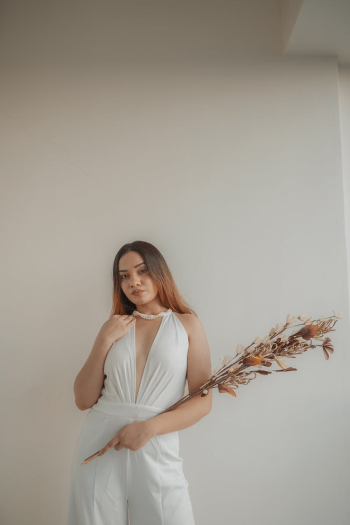 Model Posing in Elegant White Outfit Model Posing in Elegant White Outfit