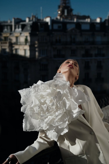 Model with Big White Flower Posing on Terrace