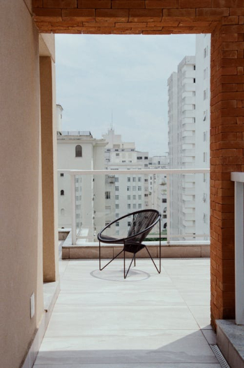 Modern chair on balcony of modern building · Free Stock Photo Modern chair on balcony of modern building · Free Stock Photo