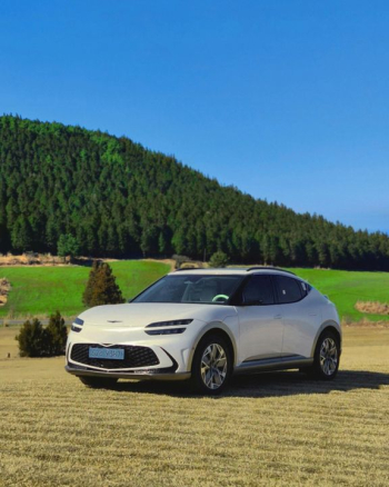 Modern Electric SUV in Scenic Landscape Modern Electric SUV in Scenic Landscape