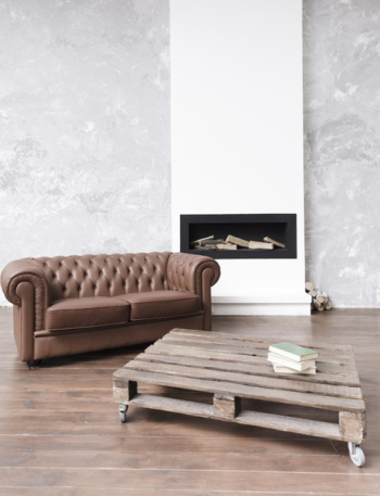 Modern minimalist living room with leather sofa and fireplace Free Photo Modern minimalist living room with leather sofa and fireplace Free Photo