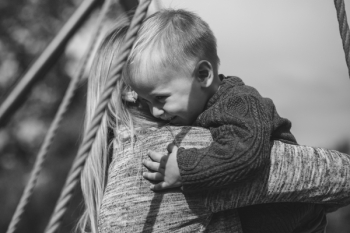 Mom and son hugging Mom and son hugging