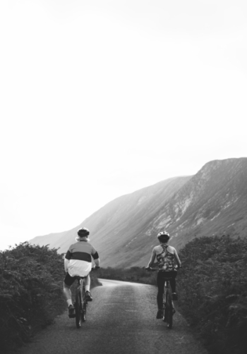 Monochrome Photo of People Riding Bicycle Monochrome Photo of People Riding Bicycle