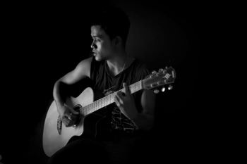 Monochrome Photography of Man Playing Guitar Monochrome Photography of Man Playing Guitar