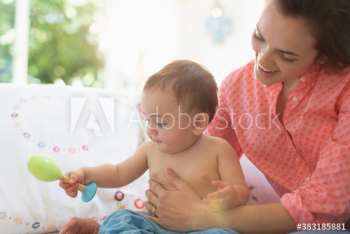 Mother and baby son playing with toys Mother and baby son playing with toys