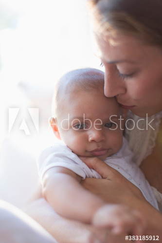 Mother holding cute baby son