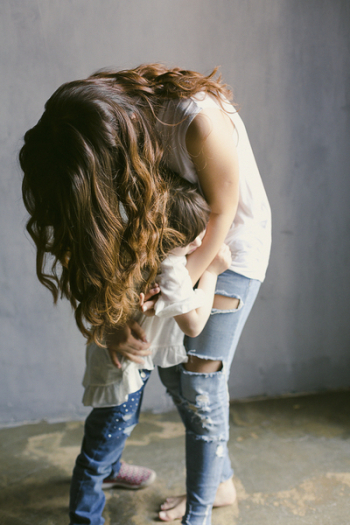 Mother Hugging Her Daughter Mother Hugging Her Daughter