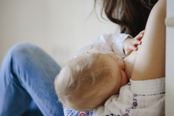Mother is breastfeeding a little blond baby Free Photo Mother is breastfeeding a little blond baby Free Photo