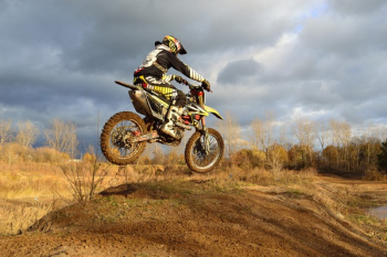 Motocross Rider on His Dirt Bike during Daytime Motocross Rider on His Dirt Bike during Daytime