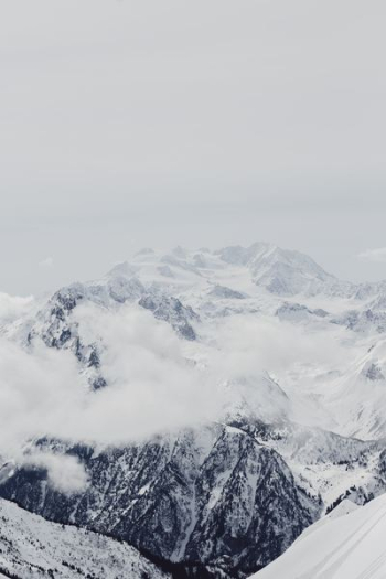 mountain alps under cumulus clouds mountain alps under cumulus clouds